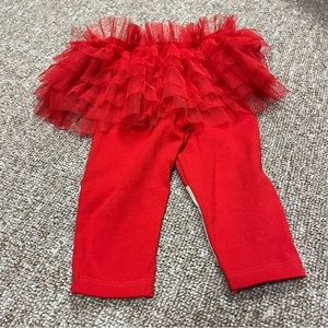 Funny holiday appliqué leggings and an attached skirt for a baby girl